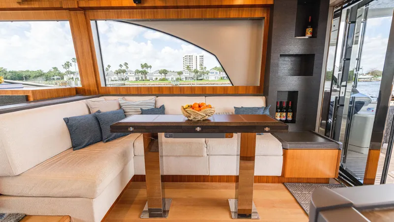 Slide: The Image of Luxurious interior of 2016 Monte Carlo Yachts MCY 65 with elegant seating and dining area. - 32
