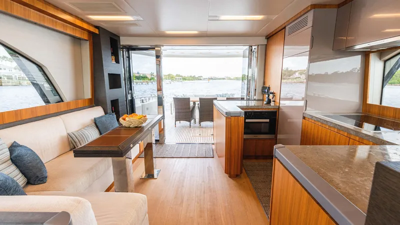 Slide: The Image of Luxurious interior of 2016 Monte Carlo Yachts MCY 65 with modern kitchen and seating area. - 33