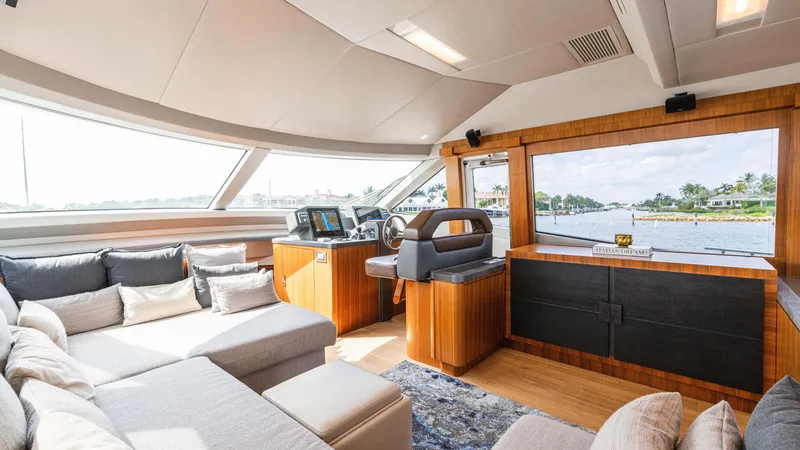 Slide: The Image of Luxurious interior of 2016 Monte Carlo Yachts MCY 65 with plush seating and panoramic windows. - 35