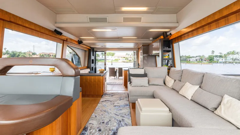 Slide: The Image of Luxurious interior of 2016 Monte Carlo Yachts MCY 65 with spacious seating and panoramic windows. - 36