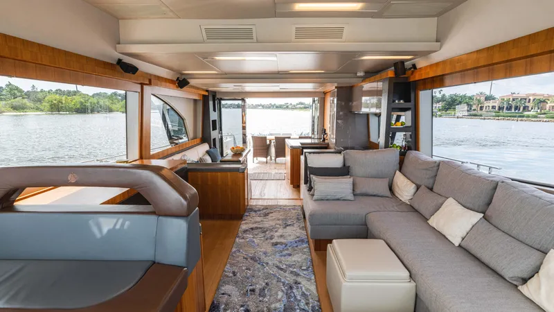 Slide: The Image of Luxurious interior of 2016 Monte Carlo Yachts MCY 65 with spacious seating and scenic water views. - 37