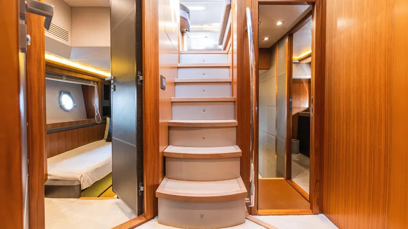 Slide: The Image of Luxurious interior of 2016 Monte Carlo Yachts MCY 65 with wooden finishes and elegant staircase. - 41