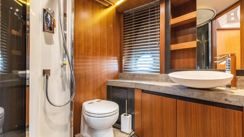 Slide: The Image of Luxurious bathroom in 2016 Monte Carlo Yachts MCY 65, featuring modern fixtures and wood accents. - 44