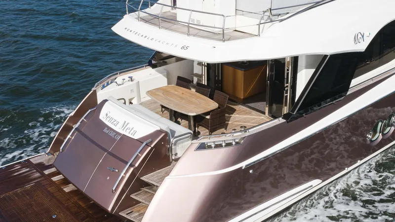 Slide: The Image of 2016 Monte Carlo Yachts MCY 65 luxury yacht cruising on the water. - 5