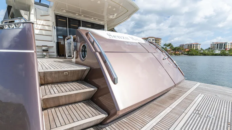 Slide: The Image of 2016 Monte Carlo Yachts MCY 65, elegant deck view with waterfront backdrop. - 6