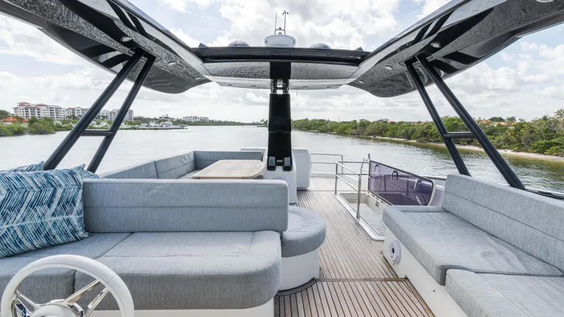 Slide: The Image of Luxurious 2016 Monte Carlo Yachts MCY 65 with spacious deck and elegant seating. - 9