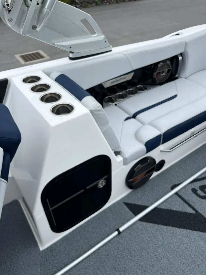 Slide: The Image of 2019 MasterCraft X26 boat interior with cup holders and seating. - 14