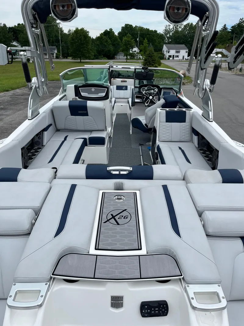 Slide: The Image of 2019 MasterCraft X26 boat interior with luxurious seating and modern design. - 26