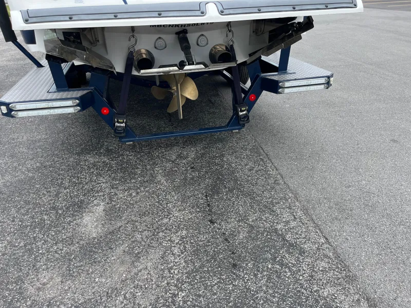 Slide: The Image of Rear view of a 2019 MasterCraft X26 boat on a trailer. - 27