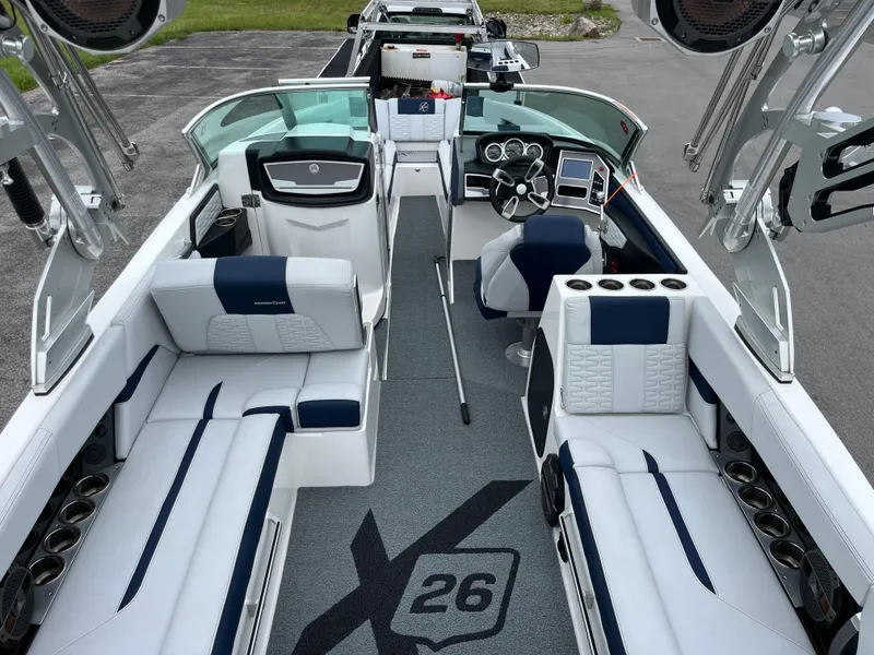 Slide: The Image of 2019 MasterCraft X26 boat interior with luxurious seating and modern dashboard. - 5