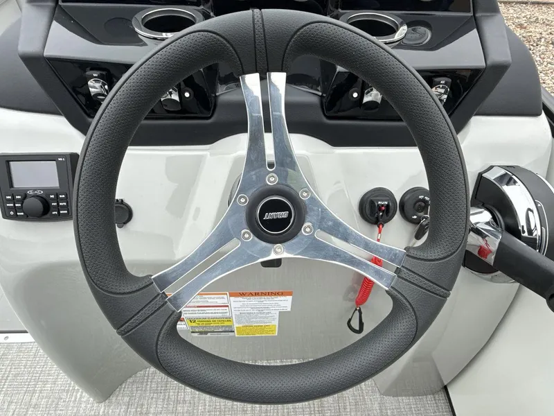 Slide: The Image of Steering wheel of 2025 Landau ISLAND BREEZE 23 boat with control panel. - 14