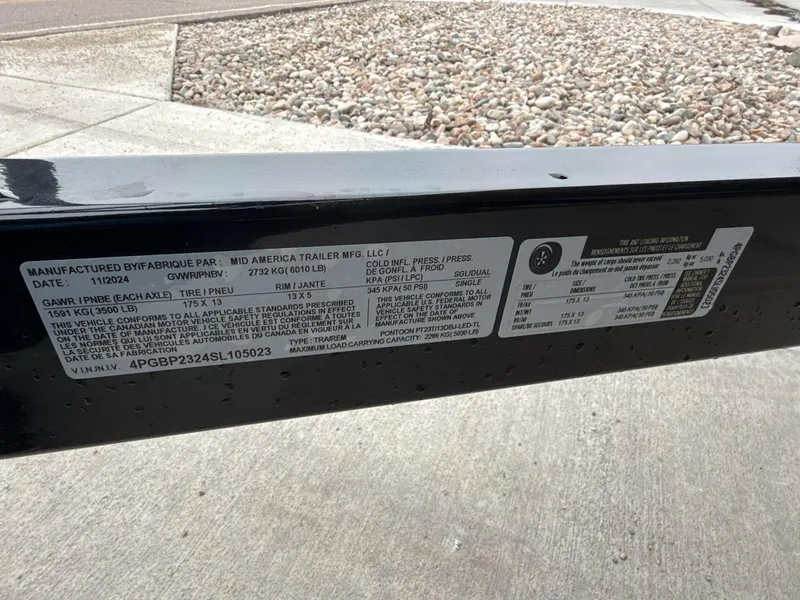 Slide: The Image of Label on a 2025 Landau ISLAND BREEZE 23 trailer, detailing specifications and compliance information. - 27