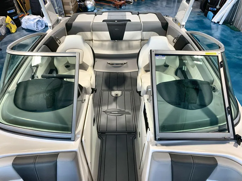 Slide: The Image of 2025 Chaparral 21 SSi boat interior with open windshield and seating area. - 12