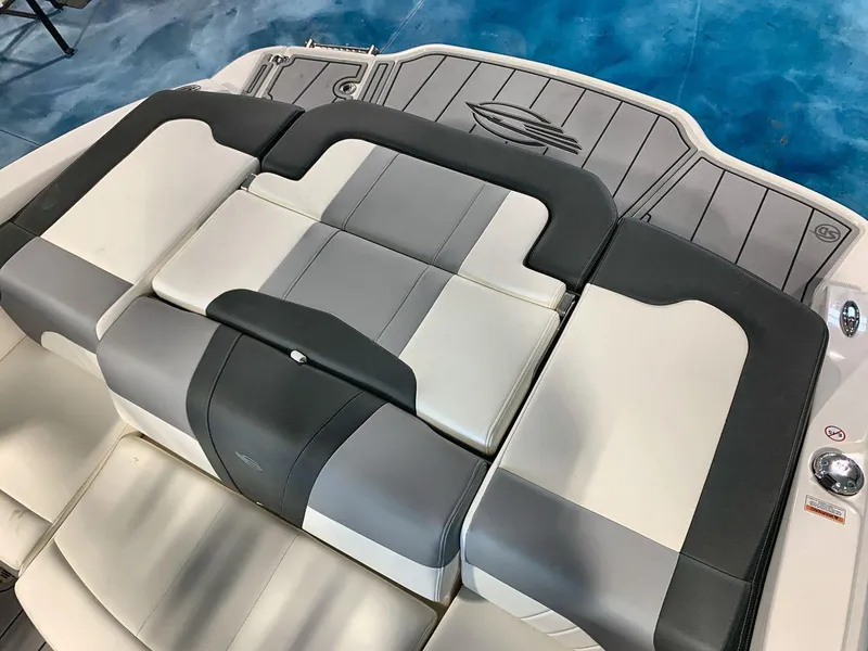 Slide: The Image of 2025 Chaparral 21 SSi boat interior with gray and white cushioned seating. - 19