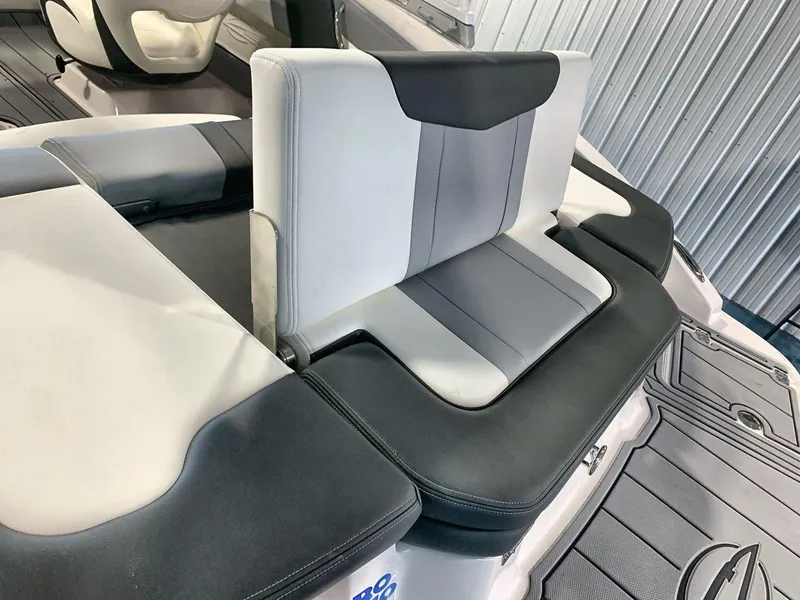 Slide: The Image of 2025 Chaparral 21 SSi boat interior with sleek, modern seating design. - 21