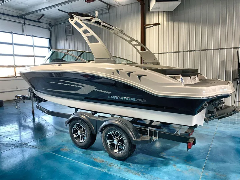 Slide: The Image of 2025 Chaparral 21 SSi boat on trailer in indoor showroom. - 3