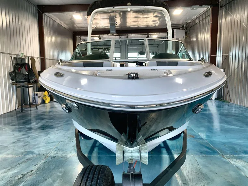 Slide: The Image of 2025 Chaparral 21 SSi boat in a storage facility, front view. - 8