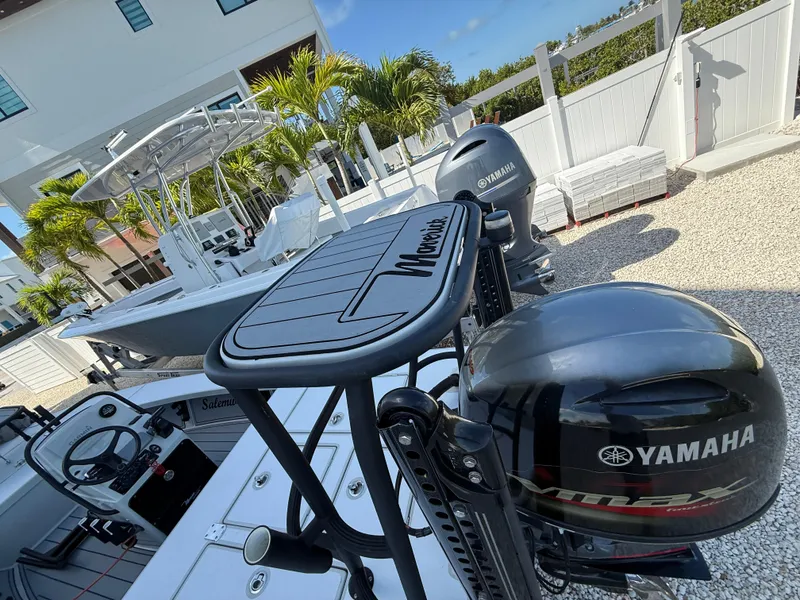 Slide: The Image of 2017 Maverick 18 HPX-V boat with Yamaha outboard motor, parked outdoors. - 11