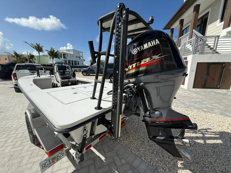 Slide: The Image of 2017 Maverick 18 HPX-V boat with Yamaha VMAX engine, parked on a sunny driveway. - 12