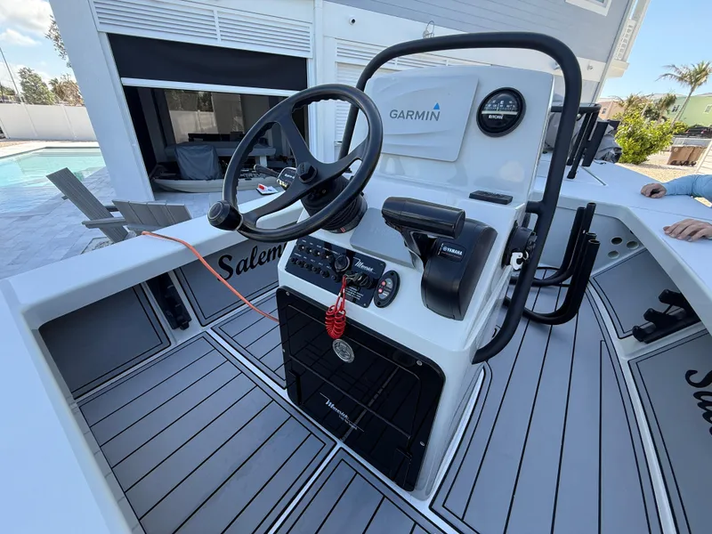 Slide: The Image of 2017 Maverick 18 HPX-V boat console with Garmin navigation and Yamaha controls. - 13