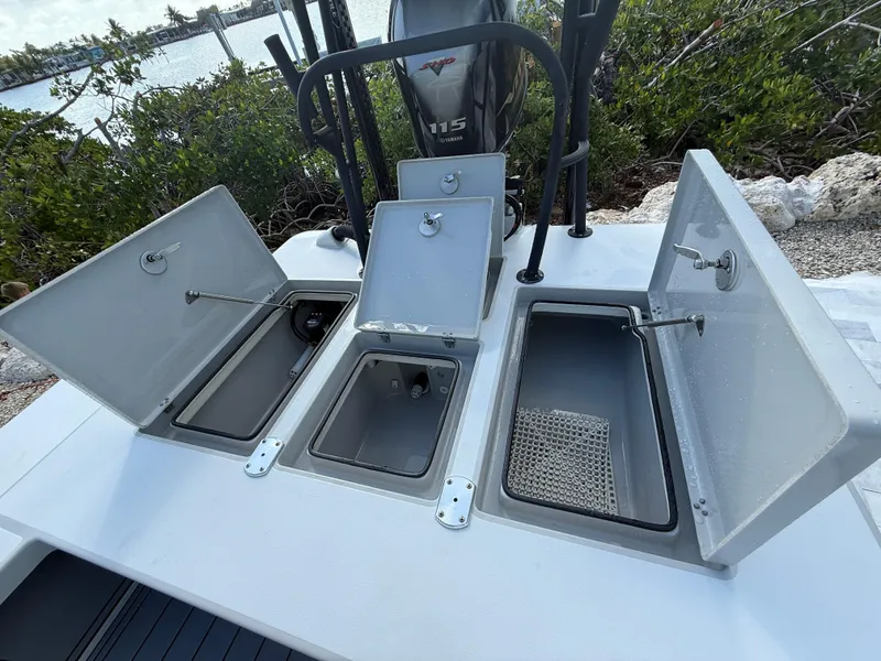 Slide: The Image of 2017 Maverick 18 HPX-V boat with open storage compartments and Yamaha 115 engine. - 14