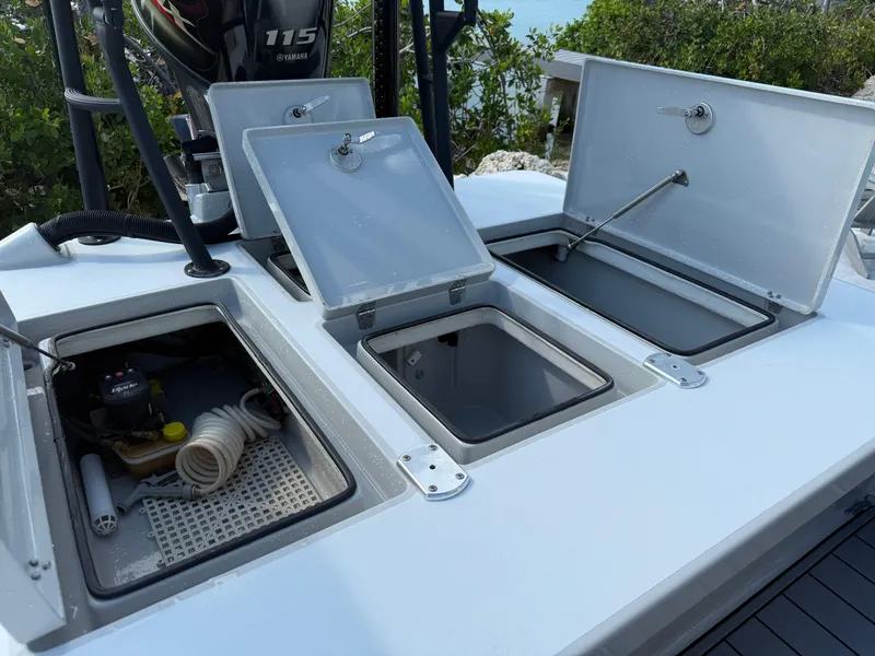 Slide: The Image of Open storage compartments on a 2017 Maverick 18 HPX-V boat with Yamaha 115 engine. - 15