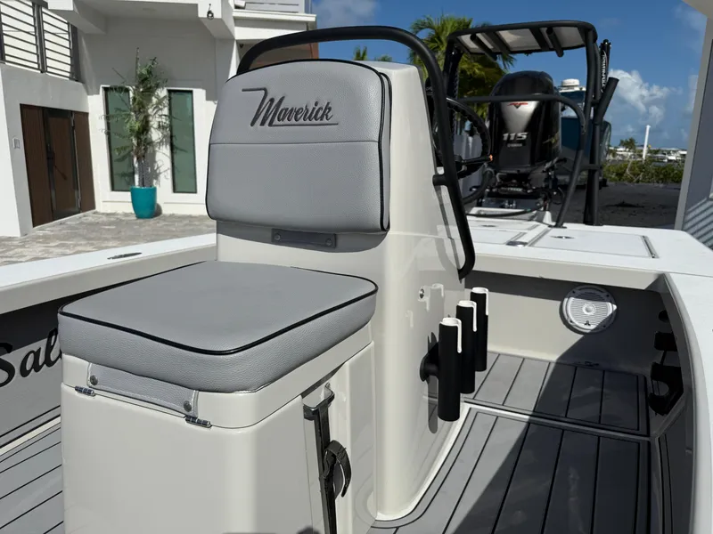 Slide: The Image of 2017 Maverick 18 HPX-V boat interior with cushioned seating and rod holders. - 17