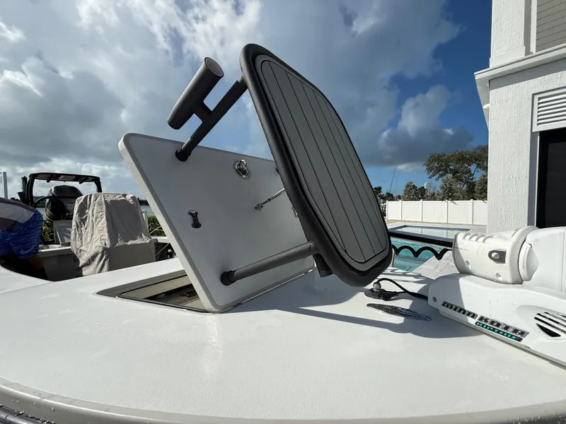 Slide: The Image of 2017 Maverick 18 HPX-V boat with open hatch, under a cloudy sky. - 19