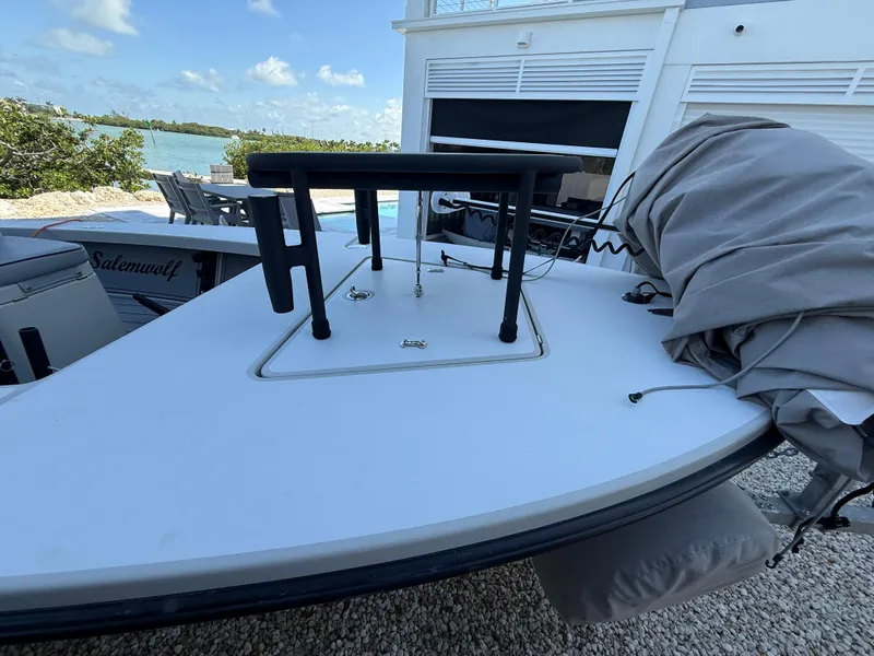 Slide: The Image of 2017 Maverick 18 HPX-V boat with a folded cover and table on deck. - 20