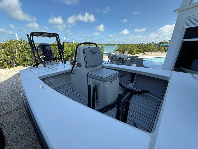 Slide: The Image of 2017 Maverick 18 HPX-V boat docked near a pool with scenic ocean view. - 22