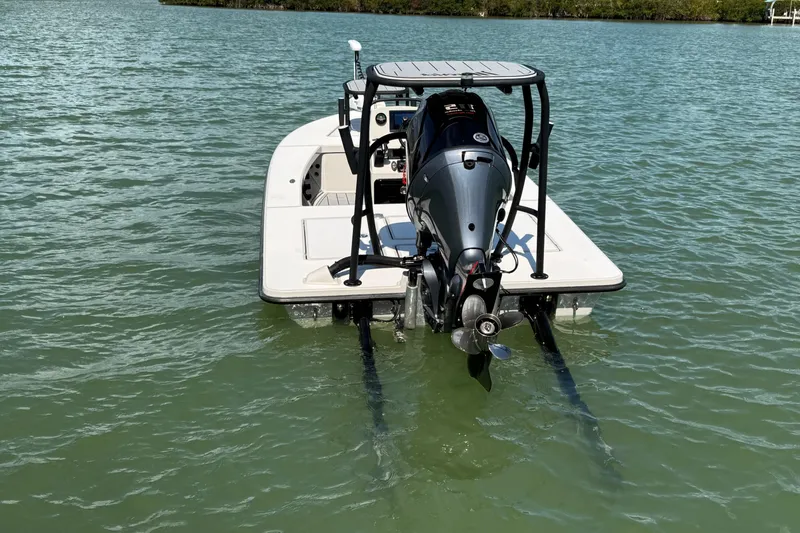 Slide: The Image of 2017 Maverick 18 HPX-V boat on water, rear view with motor. - 5