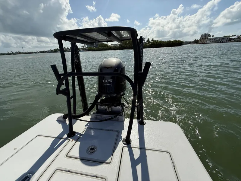 Slide: The Image of 2017 Maverick 18 HPX-V boat with Yamaha 115 engine on calm water. - 6