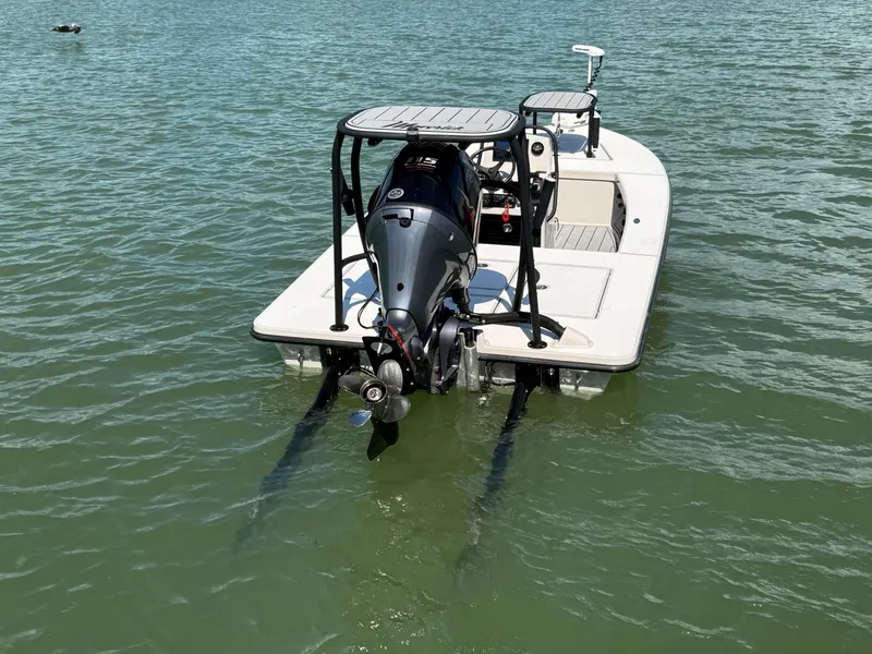 Slide: The Image of 2017 Maverick 18 HPX-V boat on water, rear view with motor visible. - 8