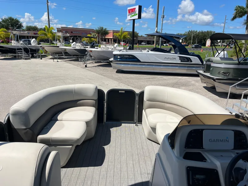 Slide: The Image of 2020 Manitou 20 Aurora LE Standard pontoon boat with spacious seating and Garmin navigation. - 11