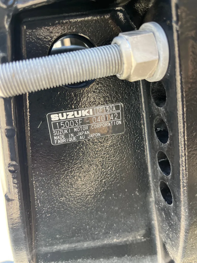 Slide: The Image of Close-up of Suzuki DF150A engine label on 2020 Manitou 20 Aurora LE Standard. - 19