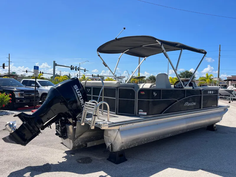 Slide: The Image of 2020 Manitou 20 Aurora LE Standard pontoon boat with Suzuki outboard motor. - 5