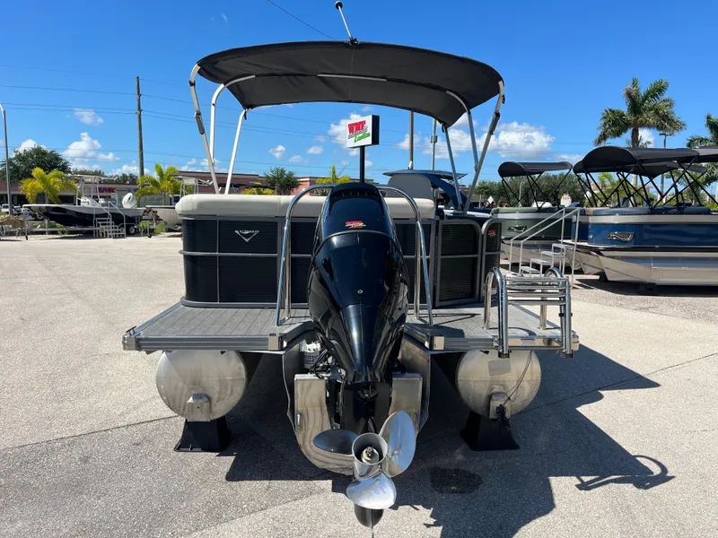 Slide: The Image of 2020 Manitou 20 Aurora LE Standard pontoon boat with canopy and outboard motor. - 6