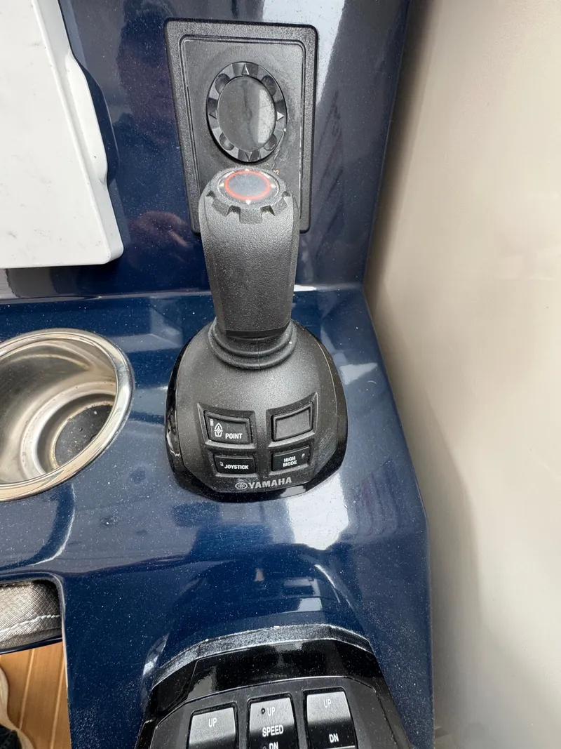 Slide: The Image of Joystick control on 2019 Pursuit DC 365 Dual Console boat dashboard. - 15
