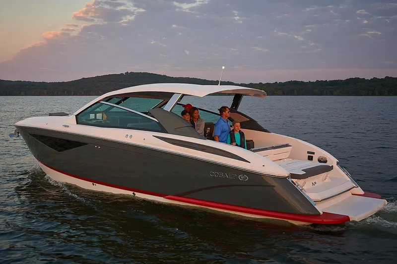 Slide: The Image of Manufacturer Provided Image: 2018 Cobalt A36 boat cruising on a lake at sunset. - 11