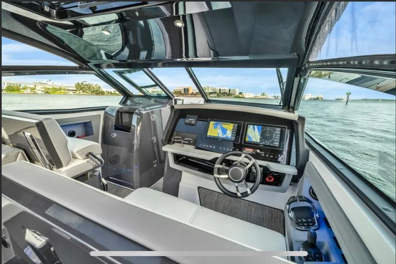 Slide: The Image of Interior of 2018 Cobalt A36 boat with modern navigation system and steering wheel. - 2