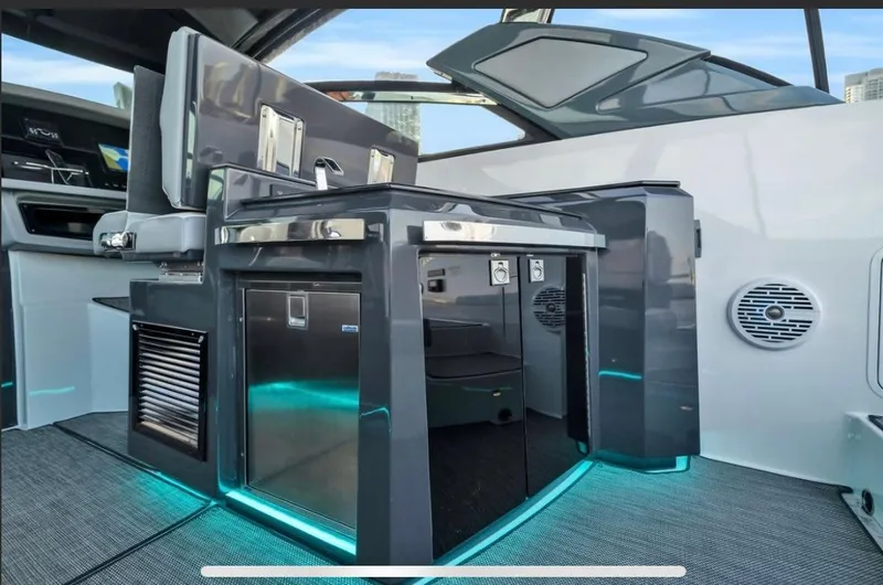 Slide: The Image of 2018 Cobalt A36 boat interior with modern kitchen and ambient lighting. - 5