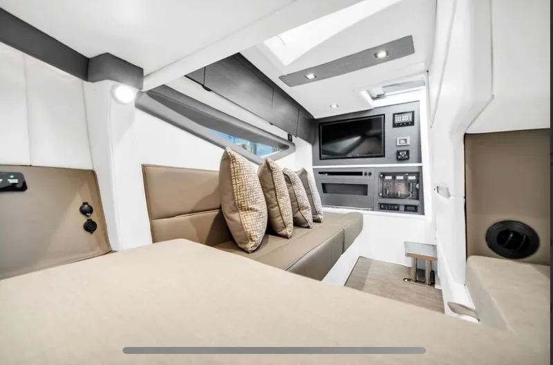Slide: The Image of Luxurious interior of 2018 Cobalt A36 boat with modern seating and entertainment system. - 7