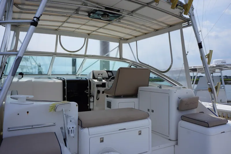 Slide: The Image of 1997 Bertram 36 Moppie boat interior with seating and helm station. - 10