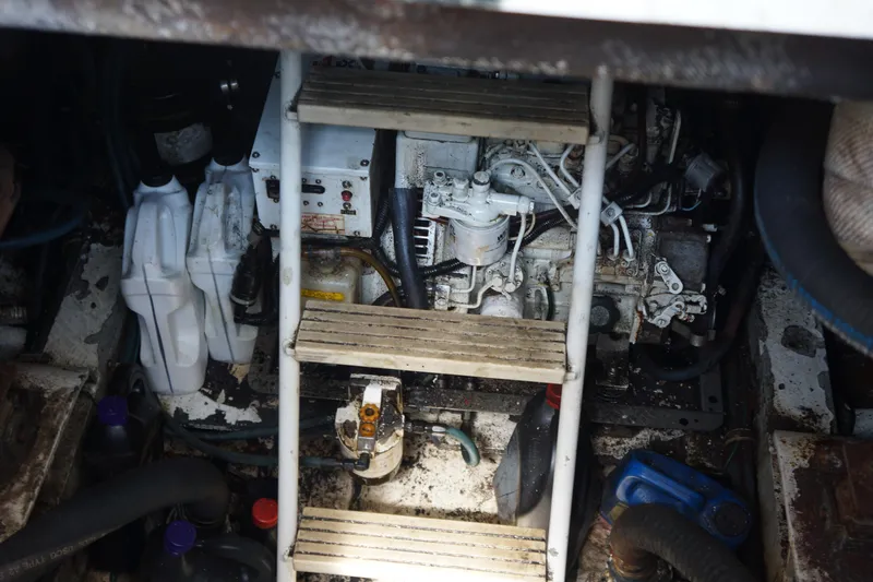 Slide: The Image of Engine room of a 1997 Bertram 36 Moppie with visible machinery and equipment. - 17