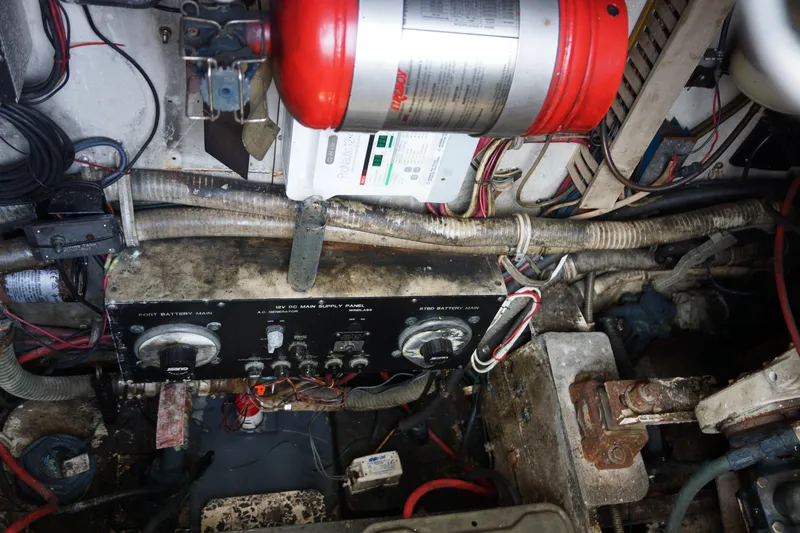 Slide: The Image of Engine room of a 1997 Bertram 36 Moppie with electrical panels and wiring. - 19