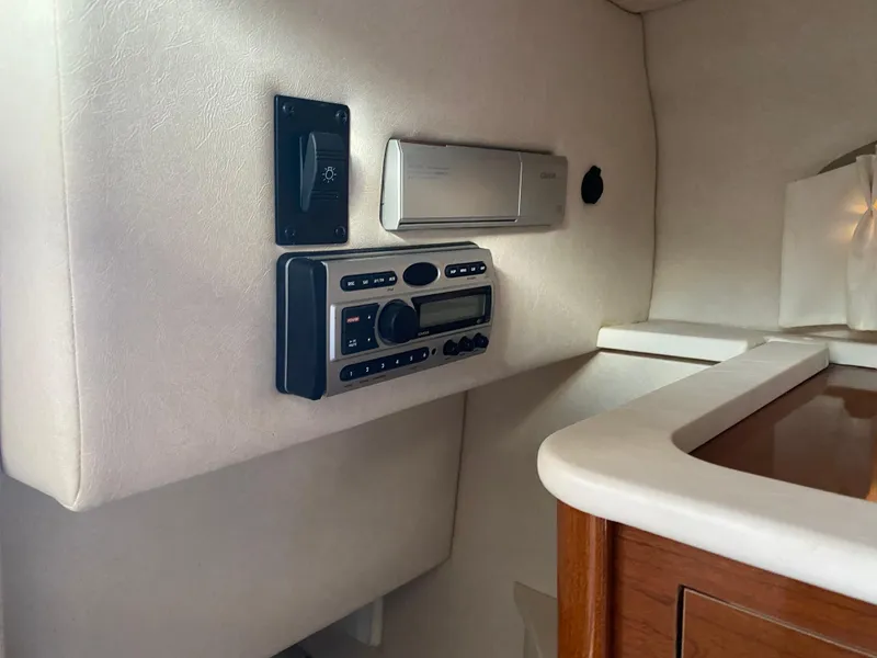 Slide: The Image of Interior of 2008 Sea Ray 270 Amberjack with stereo system and control panel. - 13