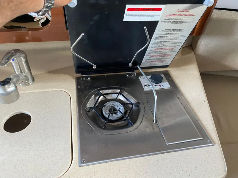 Slide: The Image of 2008 Sea Ray 270 Amberjack boat kitchen with stove and sink. - 15