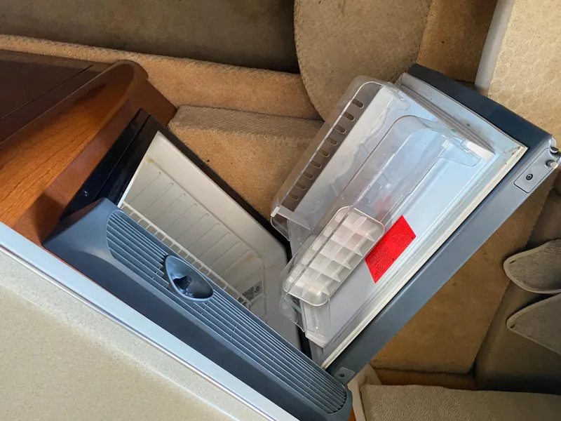 Slide: The Image of Open refrigerator inside 2008 Sea Ray 270 Amberjack boat cabin. - 17