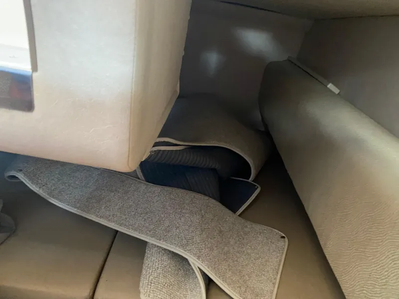 Slide: The Image of Interior view of 2008 Sea Ray 270 Amberjack with folded carpet and seating area. - 18