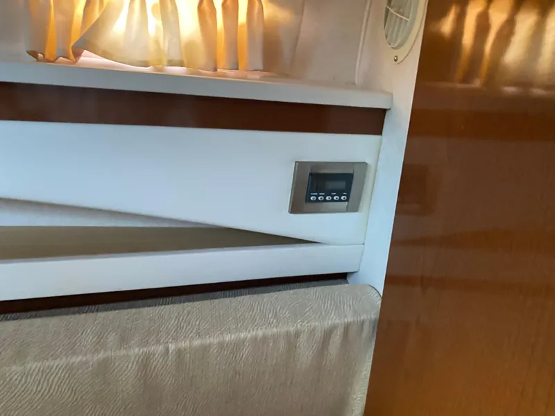 Slide: The Image of Interior of 2008 Sea Ray 270 Amberjack with control panel and curtain. - 19